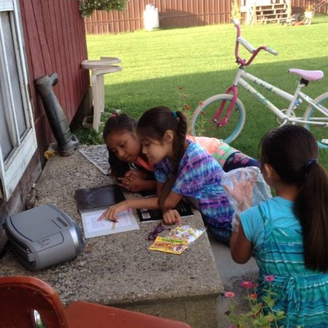 Girls reading The Lamb