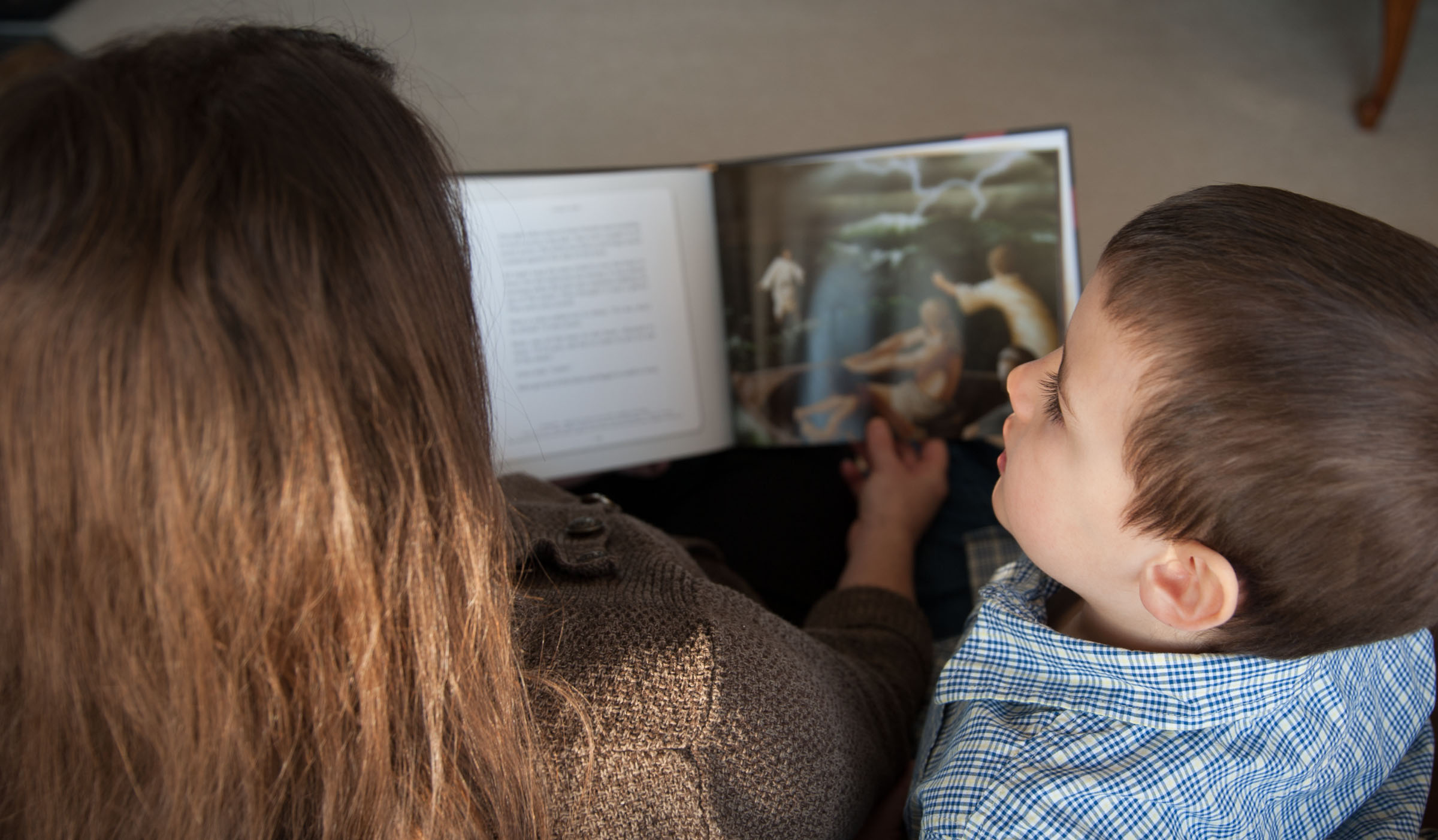 Boy, woman read The Lamb