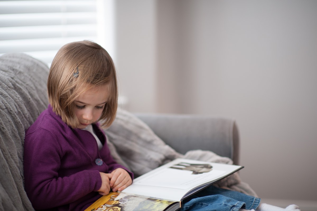 Little girl reading The Lamb